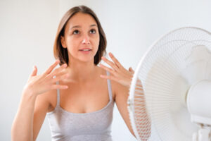 woman with a broken air conditioner