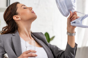 image of a homeowner dealing with a broken air conditioner