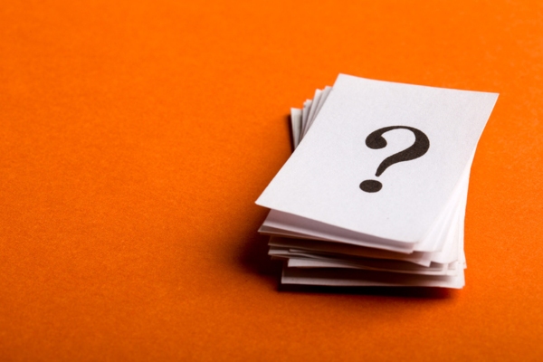 question mark on a stack of paper depicting FAQs about Bioheat® Fuel