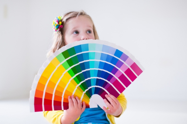 kid holding different color options depicting color choice for propane tank paint