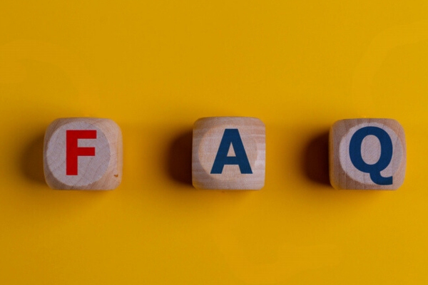 FAQ spelled using small wooden letter blocks