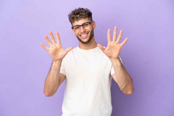 man holding 10 fingers up depicting 10 reasons why AC is not blowing cold air