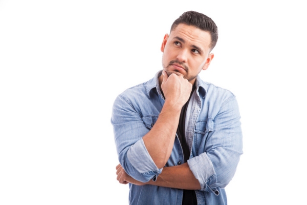 image of a man looking up depicting thinking about the differences between power surges, power outages, and brownouts