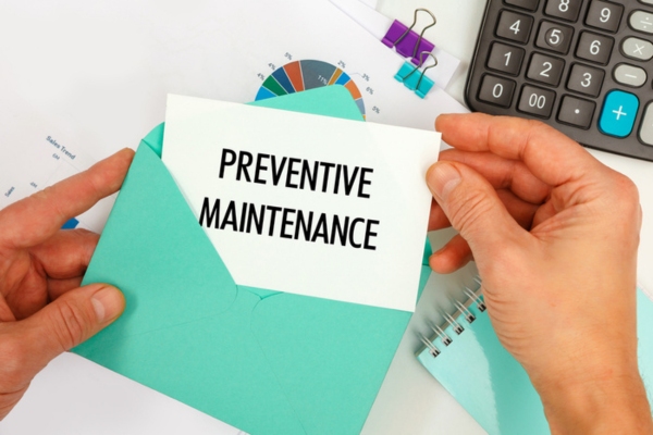 preventive maintenance written on a card from a blue green envelope depicting heating maintenance