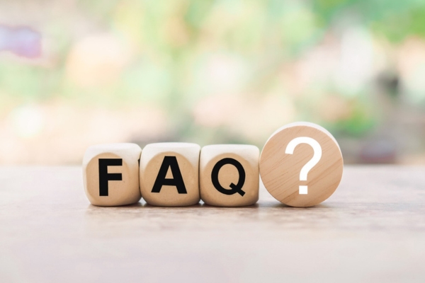 FAQ spelled using mini wooden letter blocks depicting Questions about Hydronic Oil Heating Radiator