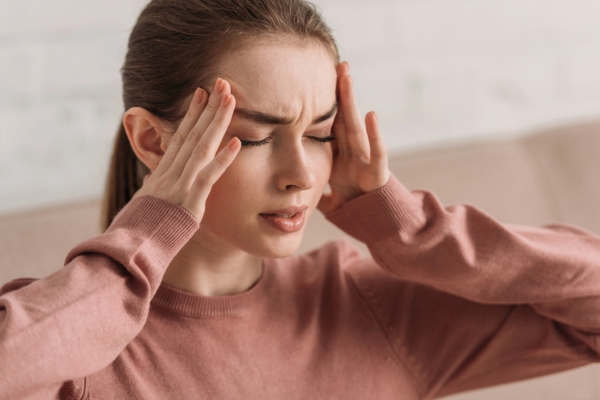 woman feeling sick depicting carbon monoxide risks