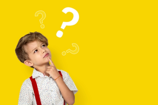 image of a boy looking at a question mark depicting FAQs about heating efficiency