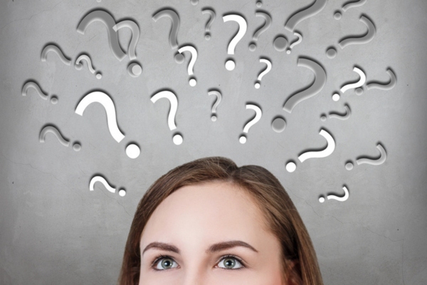 cropped image of a woman with question marks on top of head depicting questions about propane heater ventilation